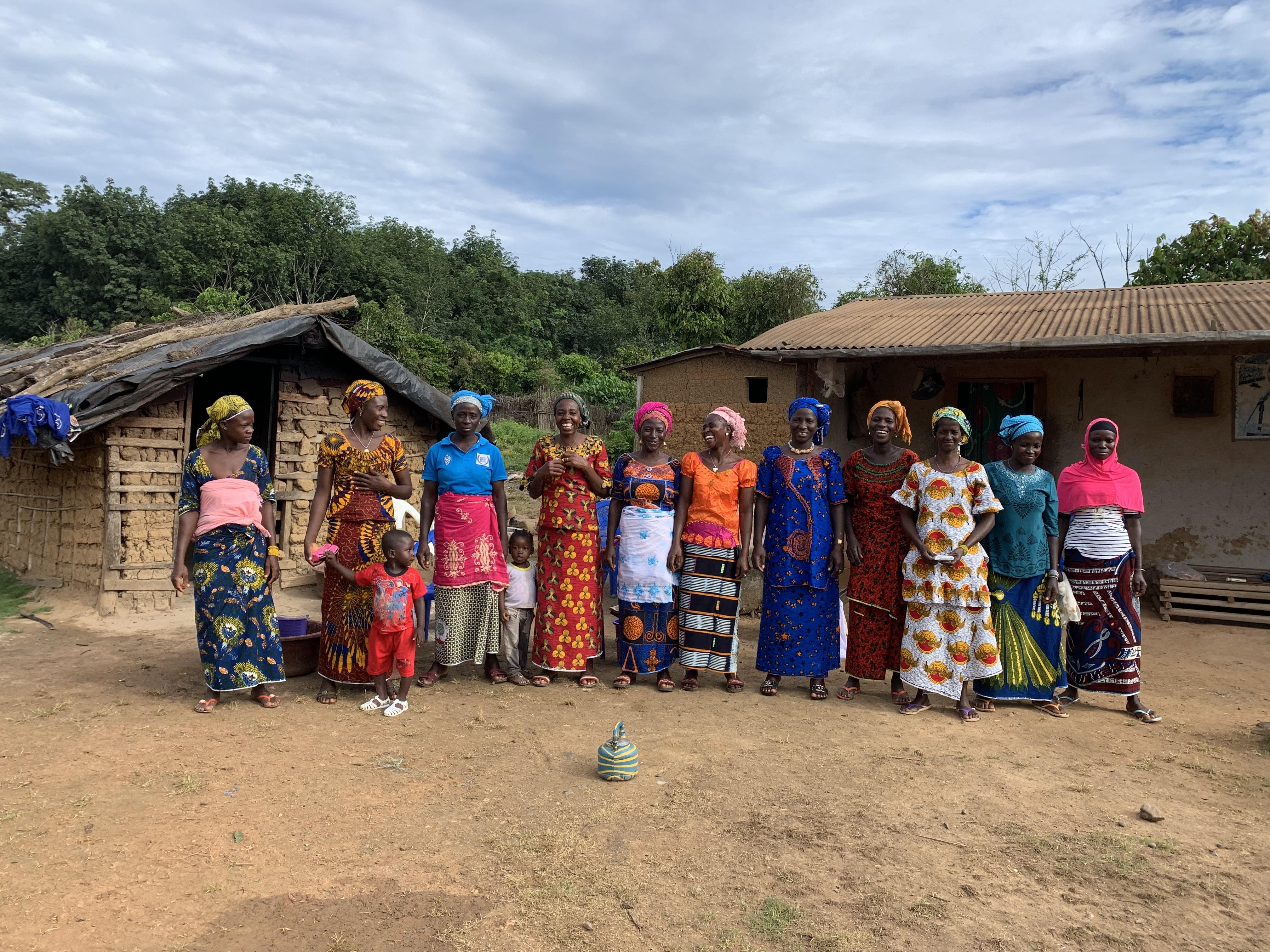 A group of women gathered in a Côte d’Ivoire village.
