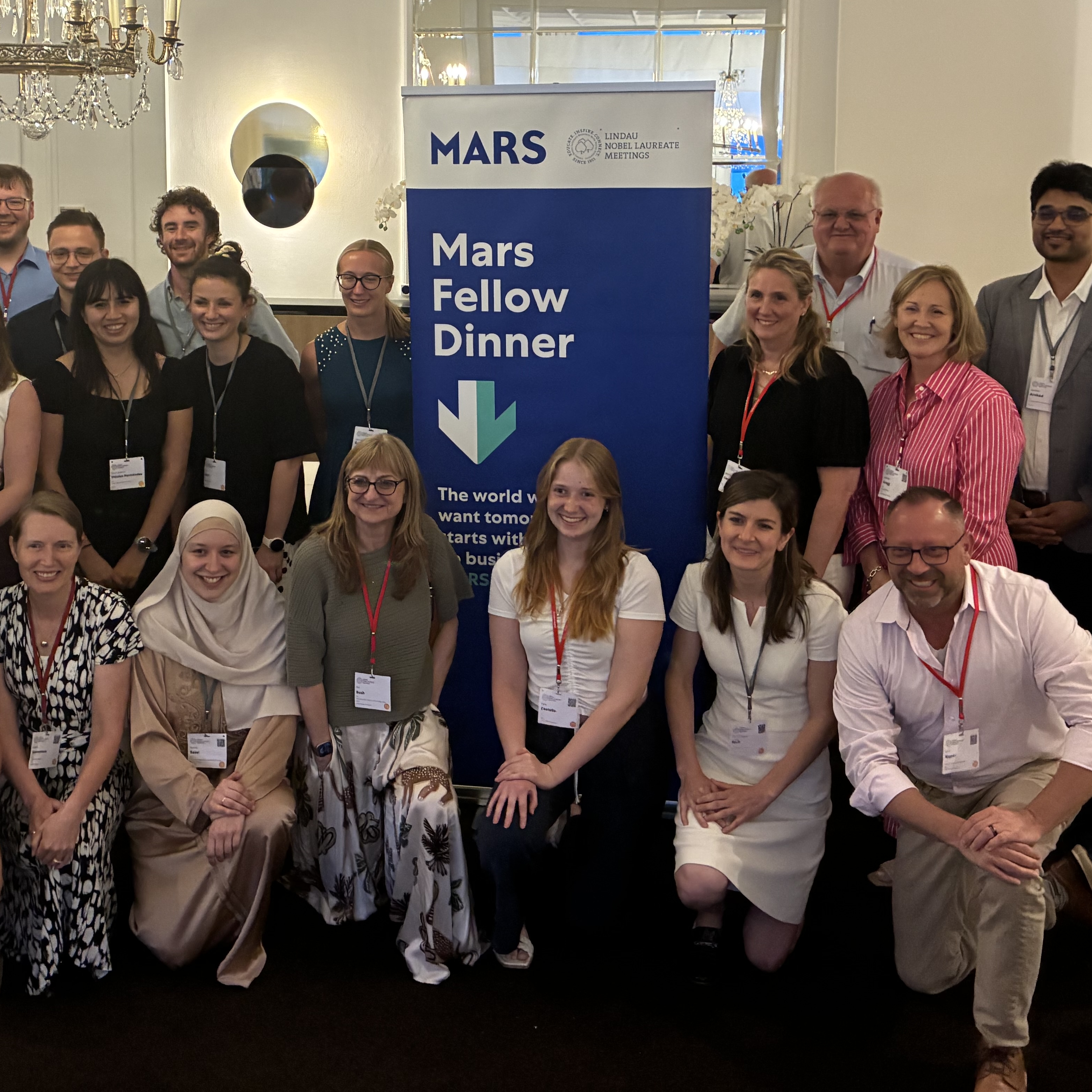 A group of Lindau attendees pose for a photo at the Mars Fellow Dinner.