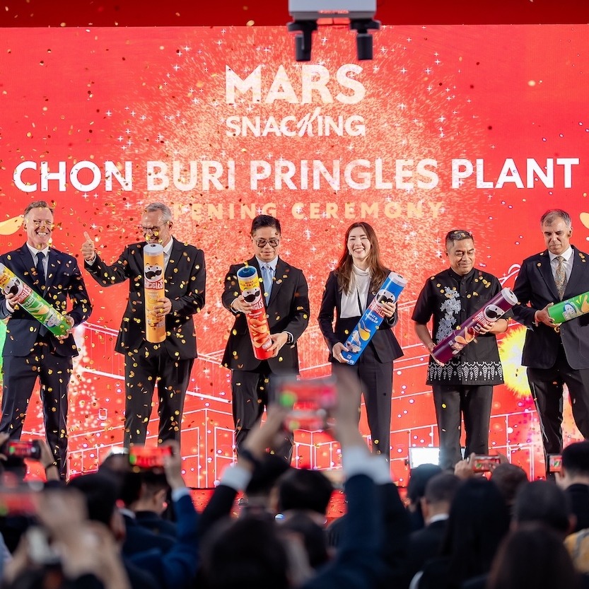 Key attendees pop open Pringles cans full of confetti at the opening ceremony of the Pringles manufacturing facility in Thailand.