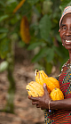 A farmer proudly displays her crops