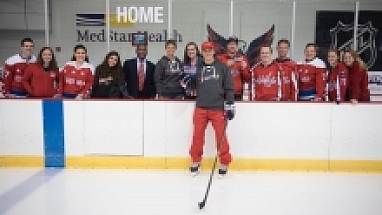 NHL player TJ Oshie poses with the Mars™ team