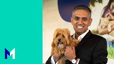 Ikdeep Singh holding his dog Mira