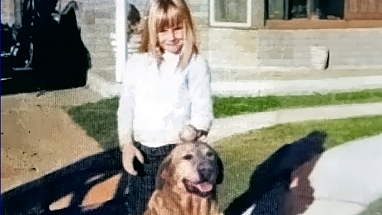 Denise Elliott as a child, with her dog Toby