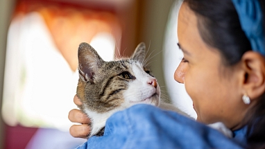 Woman holding her pet cat