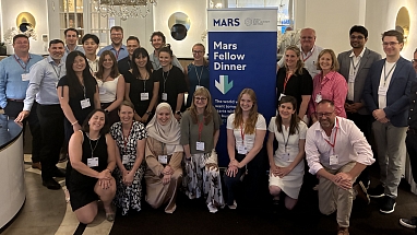 A group of Lindau attendees pose for a photo at the Mars Fellow Dinner.