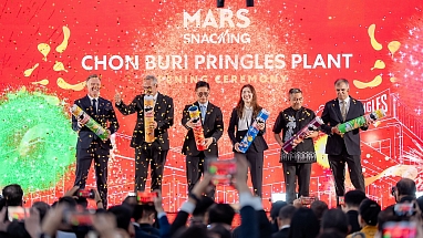 Key attendees pop open Pringles cans full of confetti at the opening ceremony of the Pringles manufacturing facility in Thailand.