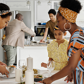 Family setting the table for dinner
