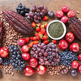 Cacao pods with various fruits on a table