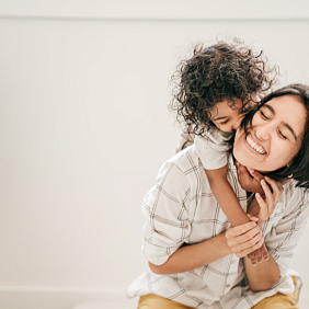 Woman and child hugging 