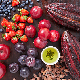 Cacao pods with various fruits on a table