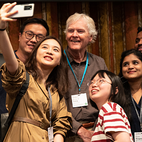 Michael W. Young poses for a selfie with other attendees of the Lindau Meeting