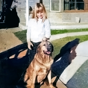 Denise Elliott as a child, with her dog Toby