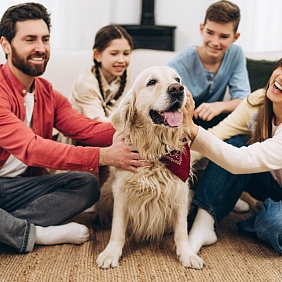 Happy family with a dog 