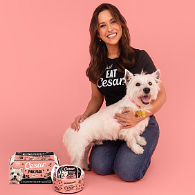 Lacey Chabert poses with the CESAR dog mascot and limited-edition Pink Packs.