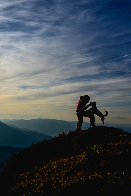 Man with dog on a mountain