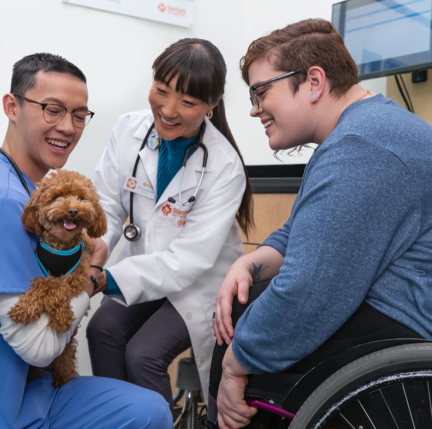 hospital staff with therapy dog